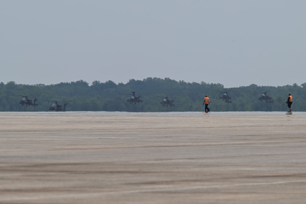 U.S. Army AH-64 Apache helicopters assigned to the 82nd Combat Aviation Brigade arrive at Joint Base Andrews.