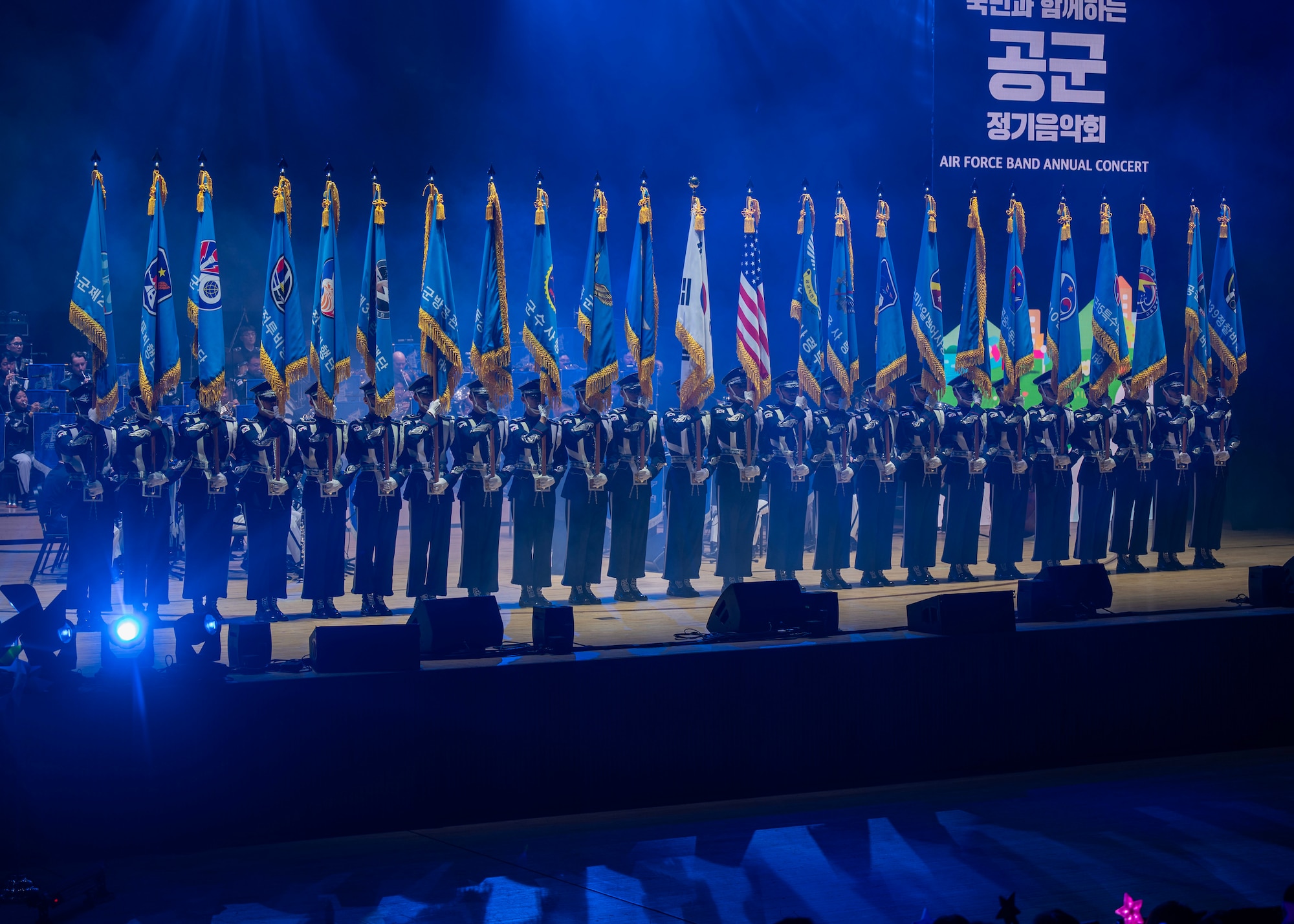 Flags are displayed during the opening ceremony of the annual Air Force Band Concert at the Korean Broadcasting System Hall in Seoul, Republic of Korea, June 12, 2025. The event celebrated the U.S.-ROK alliance through music and cultural performance. (U.S. Air Force photo by Staff Sgt. Sarah Williams)