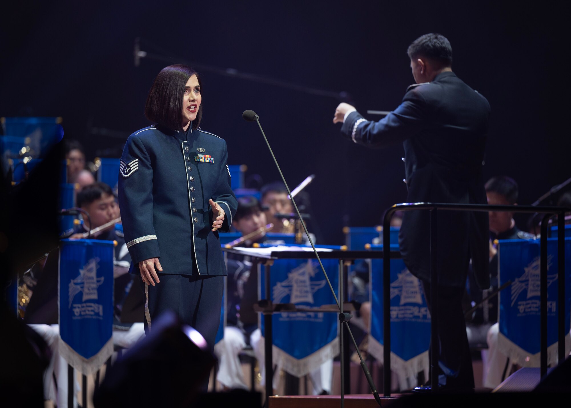 U.S. Air Force Staff Sgt. Erica Huseby, U.S. Air Force Band of the Pacific soprano, sings during the annual Air Force Band Concert at the Korean Broadcasting System Hall in Seoul, Republic of Korea, June 12, 2025. The concert highlighted the strong partnership between PACAF and ROKAF, both in music and in military cooperation. (U.S. Air Force photo by Staff Sgt. Sarah Williams)