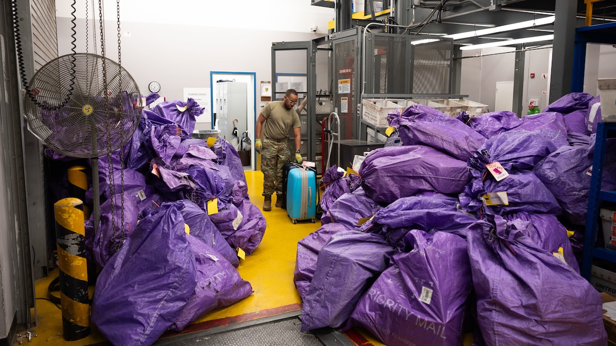 U.S. Air Force Airman Sam Laguerre, 51st Force Support Squadron military postal clerk, processes incoming mail at Osan Air Base, Republic of Korea, June 16, 2025. Hundreds of packages travel through the post office every day, delivering essential items to military personnel and families. (U.S. Air Force photo by Senior Airman Rome Bowermaster)