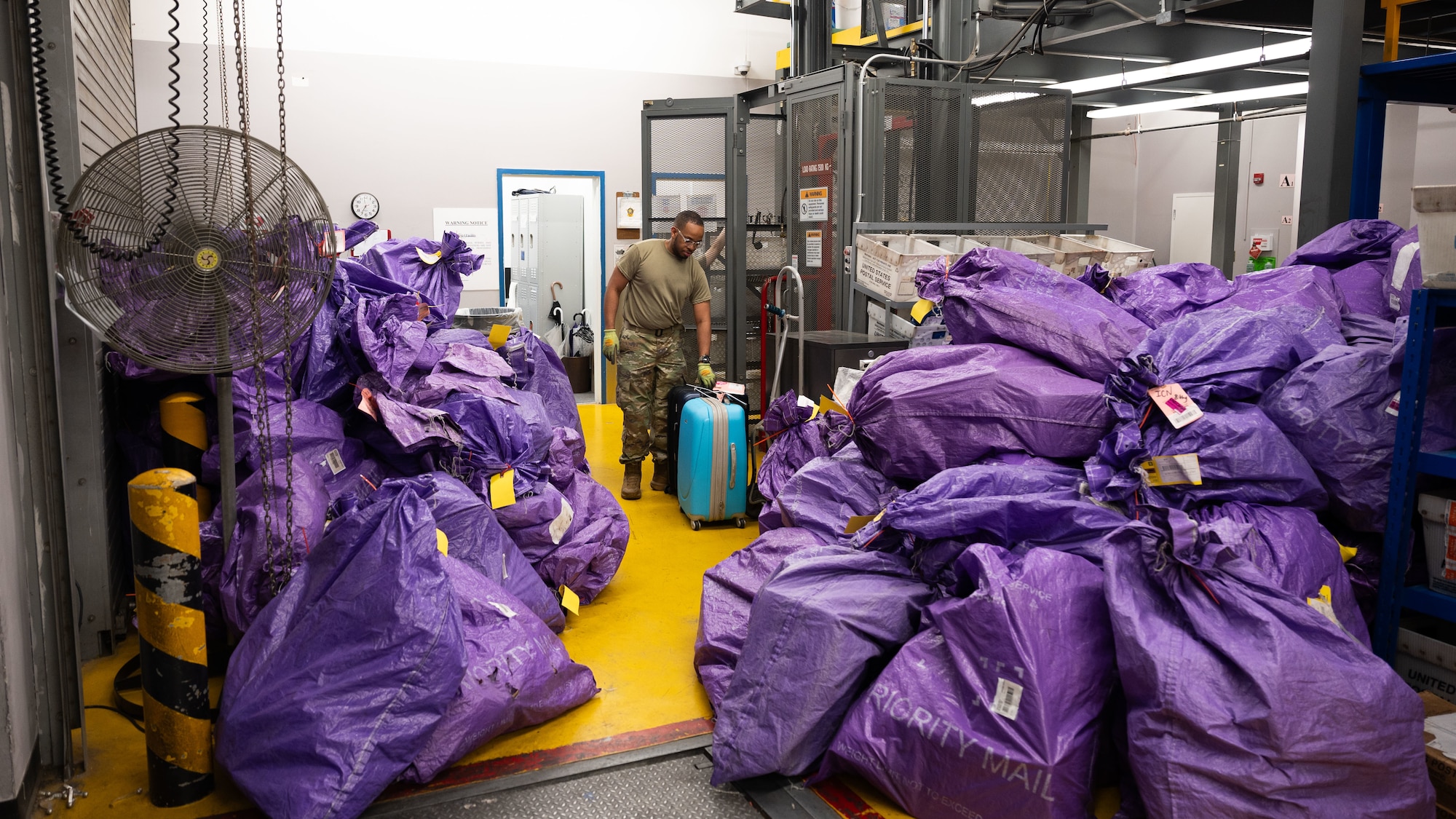 U.S. Air Force Airman Sam Laguerre, 51st Force Support Squadron military postal clerk, processes incoming mail at Osan Air Base, Republic of Korea, June 16, 2025. Hundreds of packages travel through the post office every day, delivering essential items to military personnel and families. (U.S. Air Force photo by Senior Airman Rome Bowermaster)