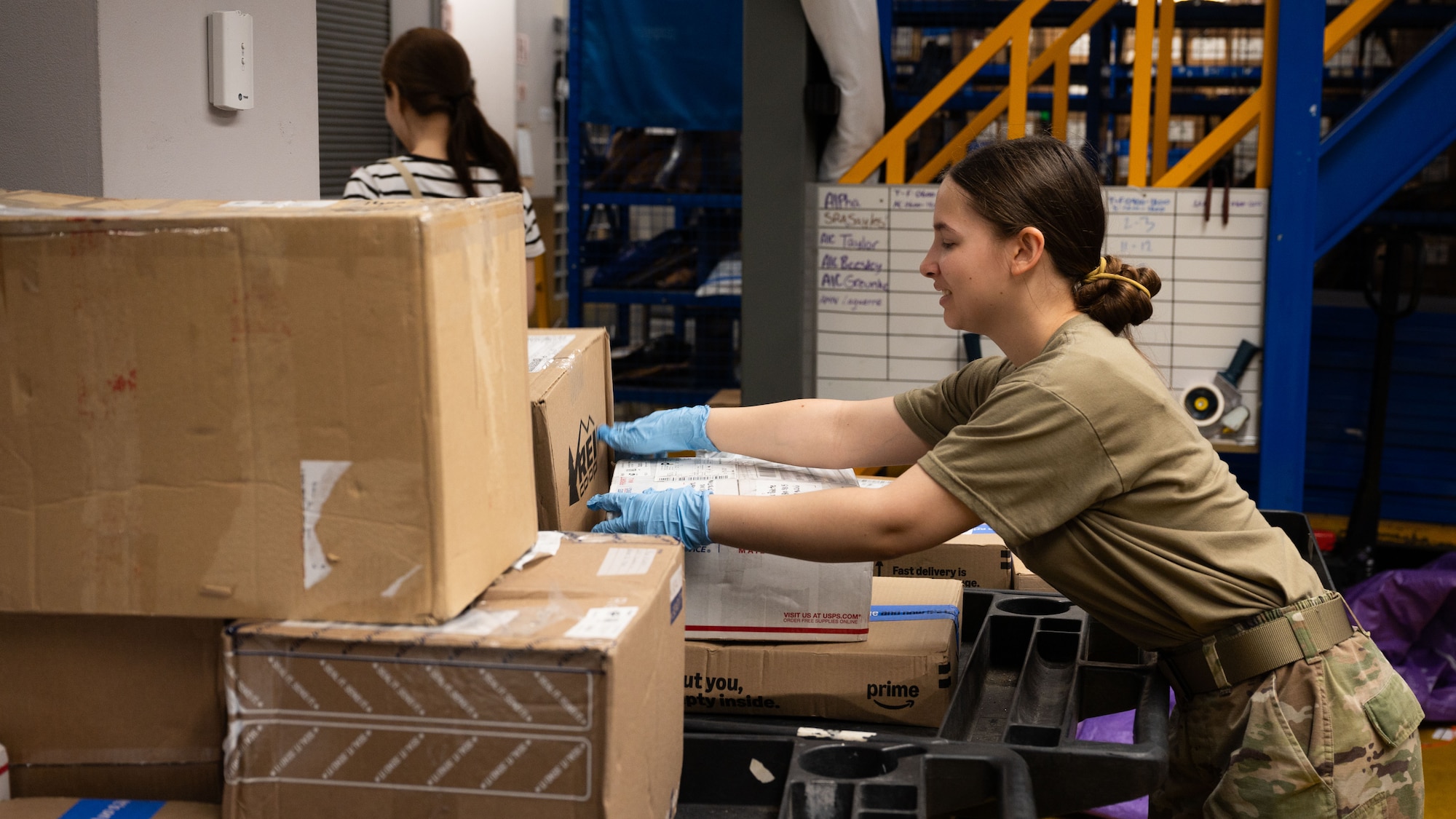 U.S. Air Force Airman 1st Class Elis Beesley, 51st Force Support Squadron military postal clerk, prepares outgoing mail for pickup at Osan Air Base, Republic of Korea, June 16, 2025. Postal clerks handle all incoming and outgoing mail, which includes organizing letters, parcels and packages. (U.S. Air Force photo by Senior Airman Rome Bowermaster)