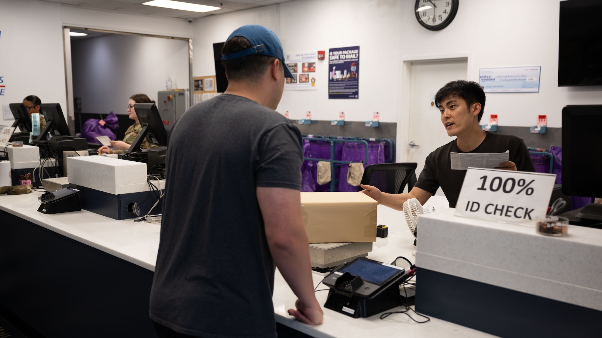 Yun Chan Cho, 51st Force Support Squadron postal clerk, assists a customer at Osan Air Base, Republic of Korea, June 16, 2025. The Osan Post Office ensures customers’ needs are met and excellence service is always provided. (U.S. Air Force photo by Senior Airman Rome Bowermaster)
