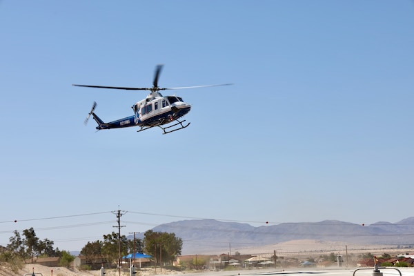 An air medical evacuation helicopter touches down on the helipad at Naval Hospital Twentynine Palms during the Semper Durus 2025 regional training exercise, May 21. As part of the simulated mass casualty scenario—staged in coordination with Marine Corps Air Ground Combat Center (MCAGCC) and other base tenants—the aircraft transported two role-playing Marines with critical injuries sustained in a notional explosion and friendly fire incident on Range 112. Emergency Department personnel awaited the inbound casualties, activating the hospital’s Mass Casualty Protocol and preparing to receive, triage, and stabilize patients as part of the hospital’s comprehensive response. The exercise tested the hospital’s ability to coordinate with partner agencies under pressure and underscored the importance of rapid decision-making, interagency communication, and real-world readiness (U.S. Navy photo by Christopher C. Jones, NHTP/NMRTC Twentynine Palms public affairs officer).
