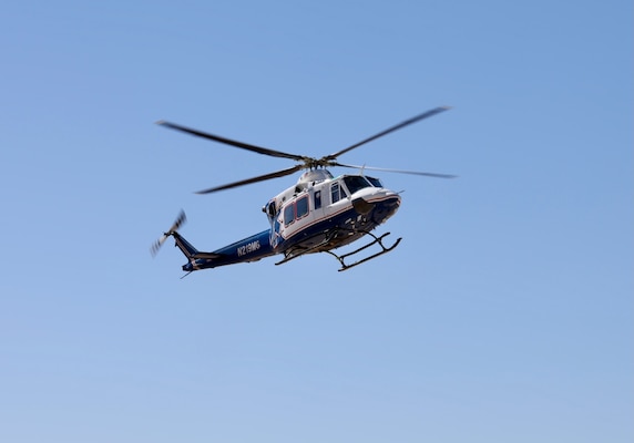 An air medical evacuation helicopter touches down on the helipad at Naval Hospital Twentynine Palms during the Semper Durus 2025 regional training exercise, May 21. As part of the simulated mass casualty scenario—staged in coordination with Marine Corps Air Ground Combat Center (MCAGCC) and other base tenants—the aircraft transported two role-playing Marines with critical injuries sustained in a notional explosion and friendly fire incident on Range 112. Emergency Department personnel awaited the inbound casualties, activating the hospital’s Mass Casualty Protocol and preparing to receive, triage, and stabilize patients as part of the hospital’s comprehensive response. The exercise tested the hospital’s ability to coordinate with partner agencies under pressure and underscored the importance of rapid decision-making, interagency communication, and real-world readiness (U.S. Navy photo by Christopher C. Jones, NHTP/NMRTC Twentynine Palms public affairs officer).