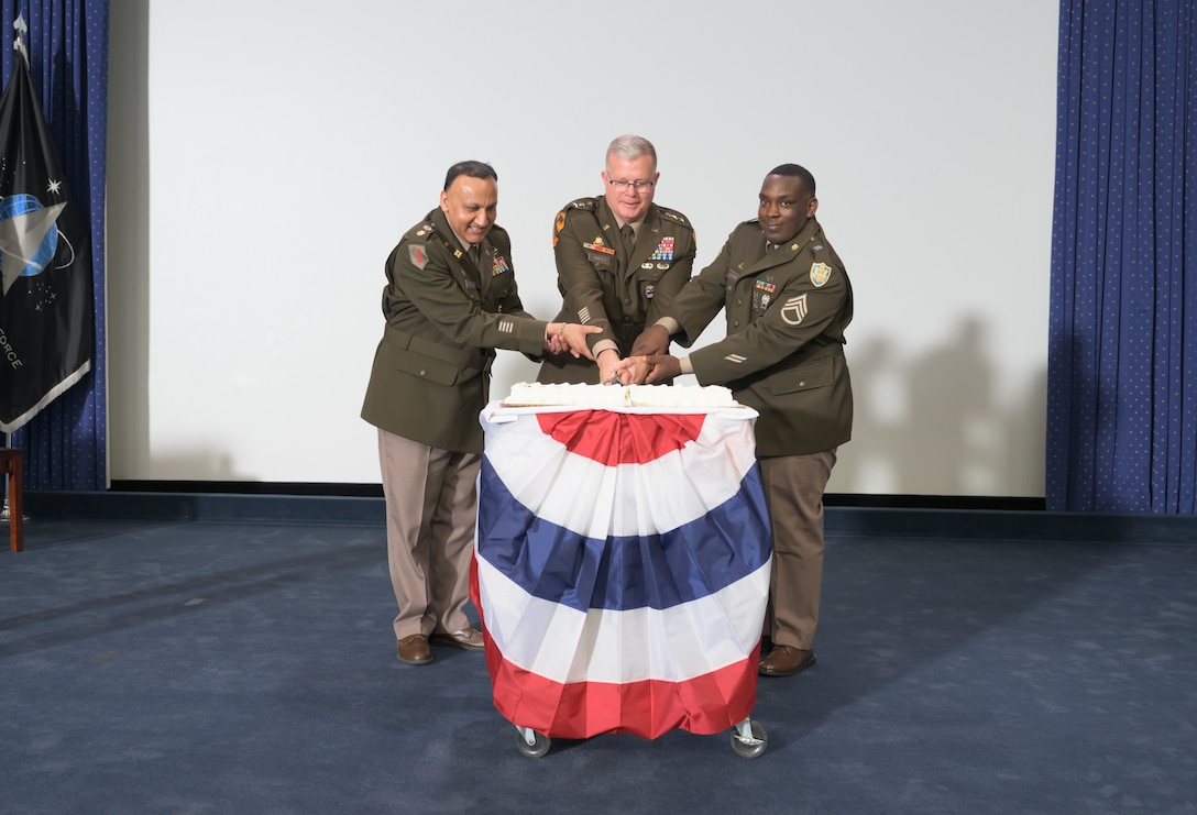 (From left to right) Army Maj. Amitabh Parshad, DLA Logistics Operations deployment operations desk officer; Army Lt. Gen. Mark Simerly, DLA director; and Army Staff Sgt. Tyrone Lowery, DLA Logistics Operations noncommissioned officer, cut the Army birthday cake during DLA’s 250th Army birthday ceremony at the McNamara Headquarters Complex Auditorium, Fort Belvoir, Virginia, June 13, 2025. Photo by Jaquan Turnbow