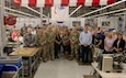 U.S. Army senior leaders from Air Warrior and Project Manager Soldier Survivability (PM SSV), a portfolio under Program Executive Office (PEO) Soldier, join Aerial Machine and Tool personnel in a group photo during a full-rate production kickoff for the Aircrew Combat Equipment (ACE) vest in Meadows of Dan, Virginia, June 4, 2025. The event commemorated the Army’s most significant upgrades in rotary-wing aircrew protection in more than two decades. (U.S. Army photo by Khylee Woodford)