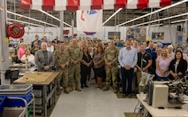 U.S. Army senior leaders from Air Warrior and Project Manager Soldier Survivability (PM SSV), a portfolio under Program Executive Office (PEO) Soldier, join Aerial Machine and Tool personnel in a group photo during a full-rate production kickoff for the Aircrew Combat Equipment (ACE) vest in Meadows of Dan, Virginia, June 4, 2025. The event commemorated the Army’s most significant upgrades in rotary-wing aircrew protection in more than two decades. (U.S. Army photo by Khylee Woodford)