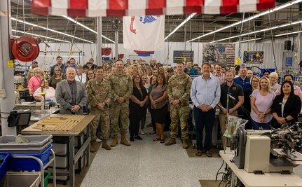 U.S. Army senior leaders from Air Warrior and Project Manager Soldier Survivability (PM SSV), a portfolio under Program Executive Office (PEO) Soldier, join Aerial Machine and Tool personnel in a group photo during a full-rate production kickoff for the Aircrew Combat Equipment (ACE) vest in Meadows of Dan, Virginia, June 4, 2025. The event commemorated the Army’s most significant upgrades in rotary-wing aircrew protection in more than two decades. (U.S. Army photo by Khylee Woodford)