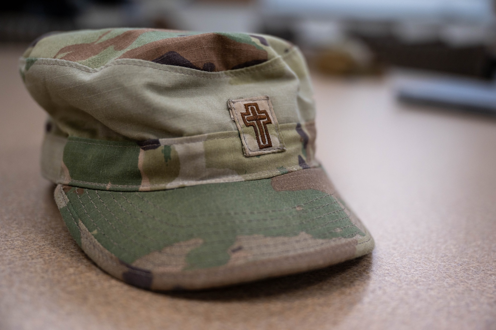 Chaplain cap lying on desk.