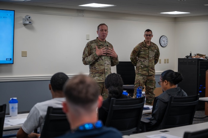 Air Force Reserve Chaplain speaks the other 403rd Wing members during a unit visit.