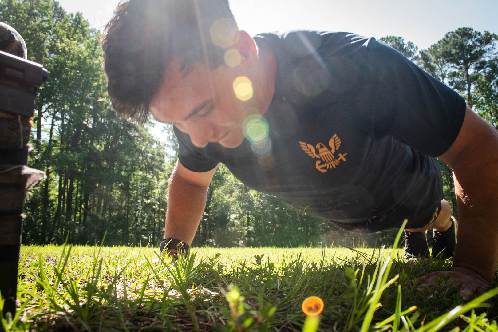 Hospital Corpsman Third Class Dru Calloway, a Sailor assigned to Naval Health Clinic Cherry Point, conducts pushups as part of the Corpsman Cup held Friday, June 13 aboard Marine Corps Air Station Cherry Point.  The event tested the Corpsmen’s’ tactical medical skills, mental resilience and physical fitness through various stations.