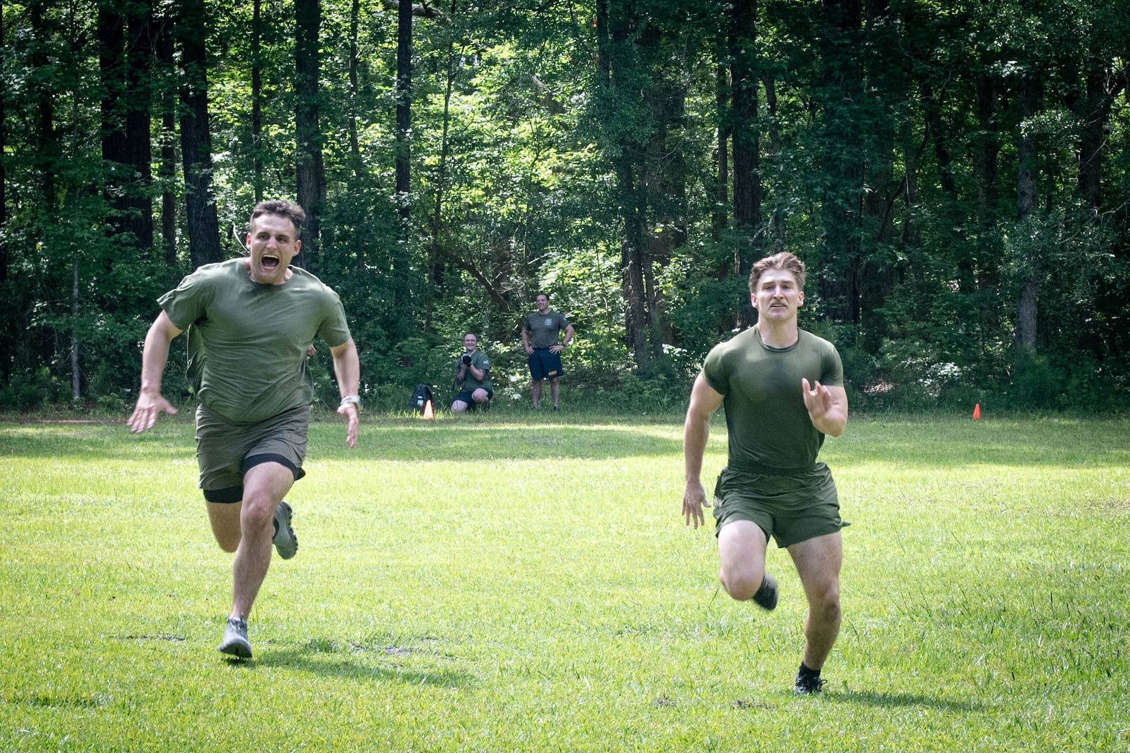Hospital Corpsman Third Class Christopher Cusson, left, and Hospital Corpsman Second Class Jon Cericola, both assigned to 2nd Marine Aircraft Wing’s Warrior Wellness and Readiness Clinic, sprint during a shuttle run event as part of the Corpsman Cup held Friday, June 13 aboard Marine Corps Air Station Cherry Point.  The event tested the Corpsmen’s’ tactical medical skills, mental resilience and physical fitness through various stations.