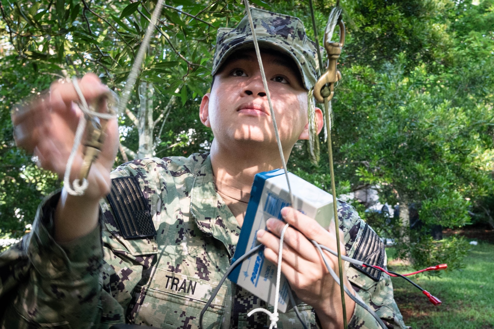 Hospitalman An Tran retrieves a mosquito trap Thursday, June 12, 2025, on Marine Corps Air Station Cherry Point. Assigned to Naval Health Clinic Cherry Point’s Preventive Medicine Department, Tran helps monitor mosquito populations to protect the base’s staff, residents and service members from disease. Collected mosquitoes are frozen and counted to assess their prevalence.