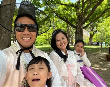 Man and family pose for a photo