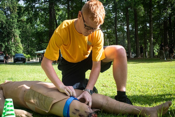 *Training* Hospital Corpsman Nicholas Regis, a Sailor assigned to Naval Health Clinic Cherry Point, applies a tourniquet to a training manikin during the Corpsman Cup held Friday, June 13 aboard Marine Corps Air Station Cherry Point.  The event tested the Corpsmen’s’ tactical medical skills, mental resilience and physical fitness through various stations.