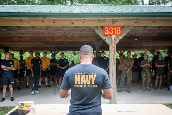 Hospital Corpsman First Class Luis Ibarra, a Sailor assigned to Naval Health Clinic Cherry Point, briefs Sailors about the upcoming events during the Corpsman Cup held Friday, June 13 aboard Marine Corps Air Station Cherry Point.  The event tested the Corpsmen’s’ tactical medical skills, mental resilience and physical fitness through various stations.