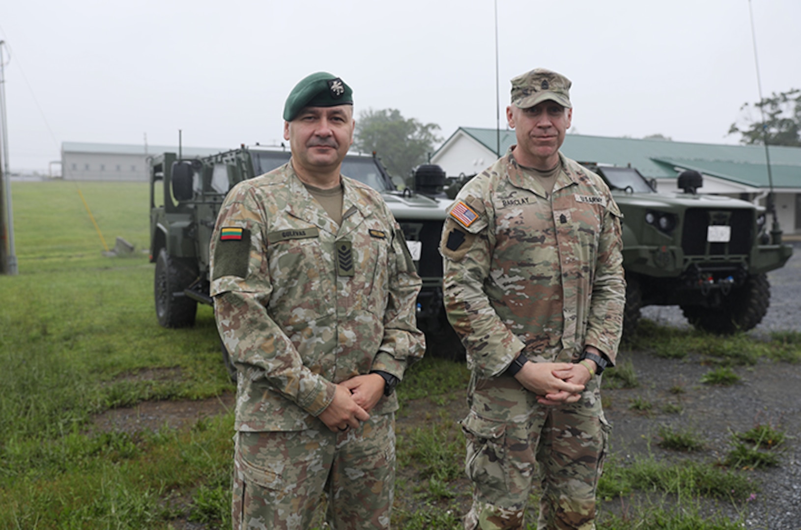 Lithuanian Command Sgt. Maj. Ruslanas Gulevas, senior enlisted leader of the Grand Duke Algirdas Infantry Battalion, Lithuanian Land Forces, left, and U.S. Army Command Sgt. Maj. Jason L. Barclay, senior enlisted advisor for 1st Battalion, 111th Infantry Regiment, 56th Stryker Brigade Combat Team, Pennsylvania Army National Guard, tour Fort Indiantown Gap as part of a bilateral engagement through the State Partnership Program, June 15, 2025.