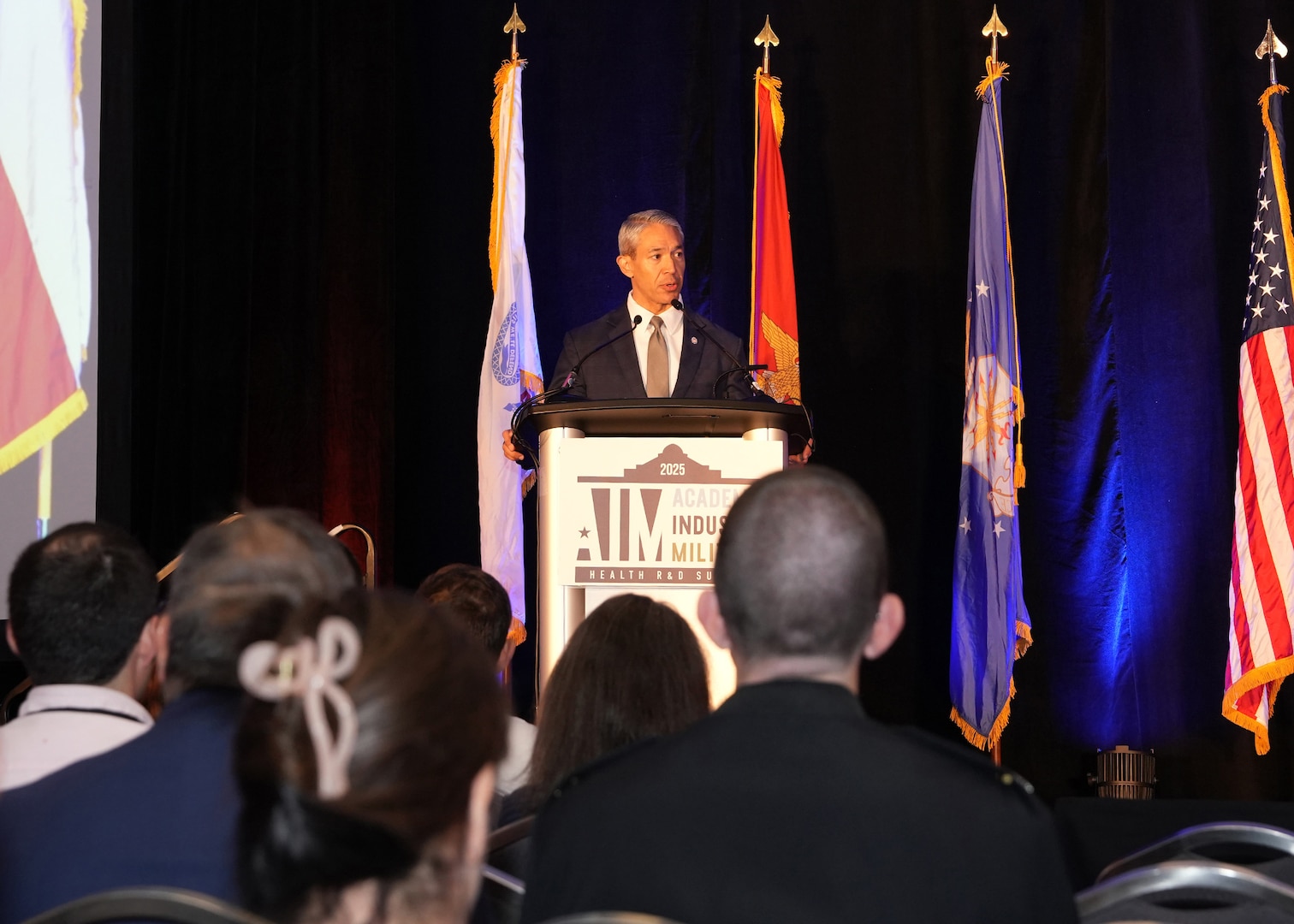 SAN ANTONIO – (June 16, 2025) – The Honorable Ron Nirenberg, mayor of San Antonio delivered welcoming remarks at the start of the annual AIM Health R&D Summit held at the Henry B. Gonzalez Convention Center. Designed to promote cross-sector collaboration in the development of life-saving battlefield technologies, the one-day summit brings together top innovators from academia, industry, and the military to accelerate the research, development, and commercialization of transformative medical technologies. Collaborating and working alongside a wide range of research and development partners keeps Navy Medicine Research & Development (NMR&D) abreast of best practices and advances in medical knowledge. NAMRU San Antonio, part of NMR&D conducts gap-driven combat casualty care, craniofacial, and directed energy research in support of Navy, Marine Corps and joint U.S. warfighter health readiness and lethality while engaged in routine and expeditionary operations. (U.S. Navy photo by Burrell Parmer, NAMRU San Antonio Public Affairs/Released)