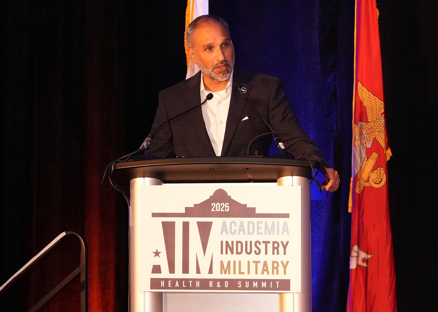 SAN ANTONIO – (June 16, 2025) – Rene Dominguez, president and CEO of VelocityTX welcomes military, academic, and industry partners and guest to the annual AIM Health R&D Summit held at the Henry B. Gonzalez Convention Center. Designed to promote cross-sector collaboration in the development of life-saving battlefield technologies, the one-day summit brings together top innovators from academia, industry, and the military to accelerate the research, development, and commercialization of transformative medical technologies. Collaborating and working alongside a wide range of research and development partners keeps Navy Medicine Research & Development (NMR&D) abreast of best practices and advances in medical knowledge. NAMRU San Antonio, part of NMR&D conducts gap-driven combat casualty care, craniofacial, and directed energy research in support of Navy, Marine Corps and joint U.S. warfighter health readiness and lethality while engaged in routine and expeditionary operations. (U.S. Navy photo by Burrell Parmer, NAMRU San Antonio Public Affairs/Released)