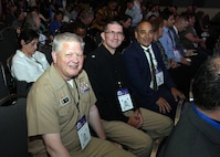 SAN ANTONIO – (June 16, 2025) – From left to right:  Naval Medical Research Unit (NAMRU) San Antonio’s Commanding Officer Captain Michael Tiller, Medical Corps, Executive Officer Cmdr. Nicholas Hamlin, Dental Corps, and Chief Science Director Dr. Darrin Frye attending the annual AIM Health R&D Summit held at the Henry B. Gonzalez Convention Center. Designed to promote cross-sector collaboration in the development of life-saving battlefield technologies, the one-day summit brings together top innovators from academia, industry, and the military to accelerate the research, development, and commercialization of transformative medical technologies. Collaborating and working alongside a wide range of research and development partners keeps Navy Medicine Research & Development (NMR&D) abreast of best practices and advances in medical knowledge. NAMRU San Antonio, part of NMR&D conducts gap-driven combat casualty care, craniofacial, and directed energy research in support of Navy, Marine Corps and joint U.S. warfighter health readiness and lethality while engaged in routine and expeditionary operations. (U.S. Navy photo by Burrell Parmer, NAMRU San Antonio Public Affairs/Released)