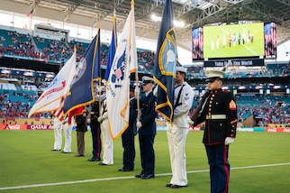 A color guard stands at attention on the soccer field at Hard Rock Stadium during the FIFA Club World Cup opening ceremeony