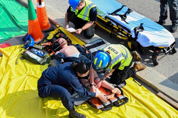 250604-N-FT324-2338. ROTA, Spain (June 4, 2025). Hospitalman Jacob Adams and Hospitalman Kayli Bollinger, assigned to Navy Medicine Readiness and Training Command Rota’s Emergency Department, participate in a real-life simulation scenario responding to a shipboard fire exercise. This type of training reinforces critical emergency response skills that enhance medical readiness and ensures rapid, effective care in operational environments. At NMRTC Rota, Sailors are being trained to become Emergency Medical Technicians (EMTs) through a rigorous and mission-driven EMT-Basic (EMT-B) certification program. (U.S. Navy photo Released by Lt. Cmdr. Alicia Sacks)