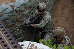 U.S. Army Soldiers assigned to Charlie Company, 1st Battalion, 125th Infantry Regiment, Michigan Army National Guard, maneuver through the trenches during Exercise Baltic Viking near Alūksne, Latvia, June 8, 2025. Large-scale Combat Operations involve extensive military engagements, coordinated strategies, and significant resource deployment across vast areas.  The U.S. military participates in multinational training and exercises across Europe to increase lethality and strengthen partnerships with NATO allies and regional security partners.