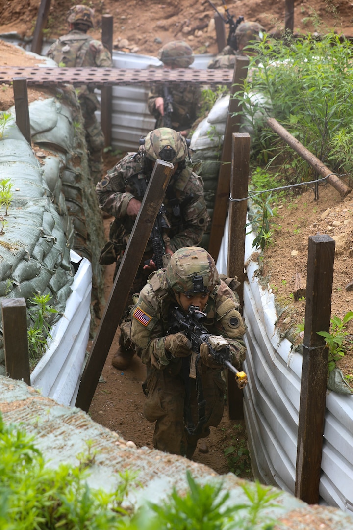 U.S. Army Soldiers assigned to Charlie Company, 1st Battalion, 125th Infantry Regiment, Michigan Army National Guard, tactically maneuver through a system of trenches during Exercise Baltic Viking near Alūksne, Latvia, June 8, 2025.