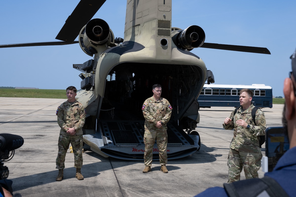 Sgt. William Reinier, right, briefs media personnel during a media engagement.