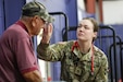 Army Reserve Staff Sgt. Adelaida Glinski, a licensed practical nurse with the Newark, Del. based 7221st Medical Support Unit and temporarily augmented to the Picatinny Arsenal, Dover, N.J. based 7245th MSU, takes the temperature of a patient at an Innovative Readiness Training on the MOWA Choctaw Indian Reservation in Mount Vernon, Ala., June 9, 2025. Soldiers were able to build bonds with the local community by offering limited medical, dental, optometry and veterinary services at no-cost to the civilians, all while receiving training on deployment readiness. (U.S. Army Reserve photo by Sgt. Jerry T. Zuetrong)