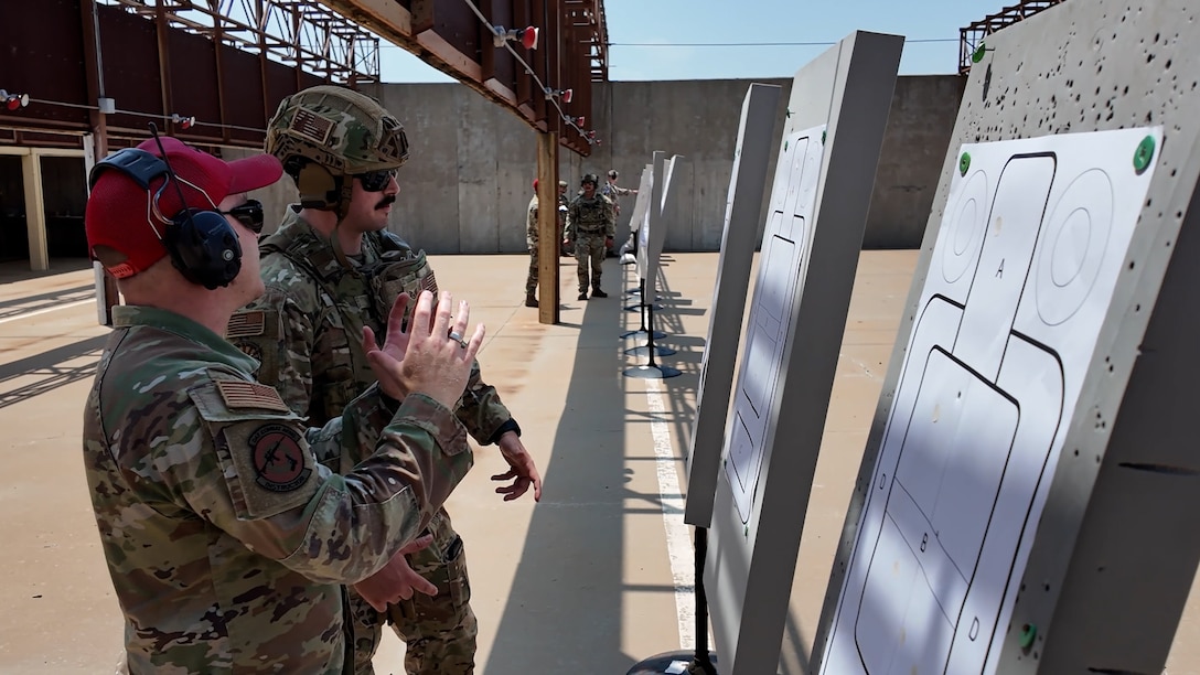 Participants inspect target for accuracy during the marksmanship part of the German Armed Forces Proficiency Badge.