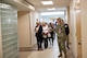 An Airman guides a tour group of civilian medical providers through Minot Air Force Base's military treatment facility.