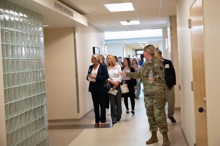 An Airman guides a tour group of civilian medical providers through Minot Air Force Base's military treatment facility.
