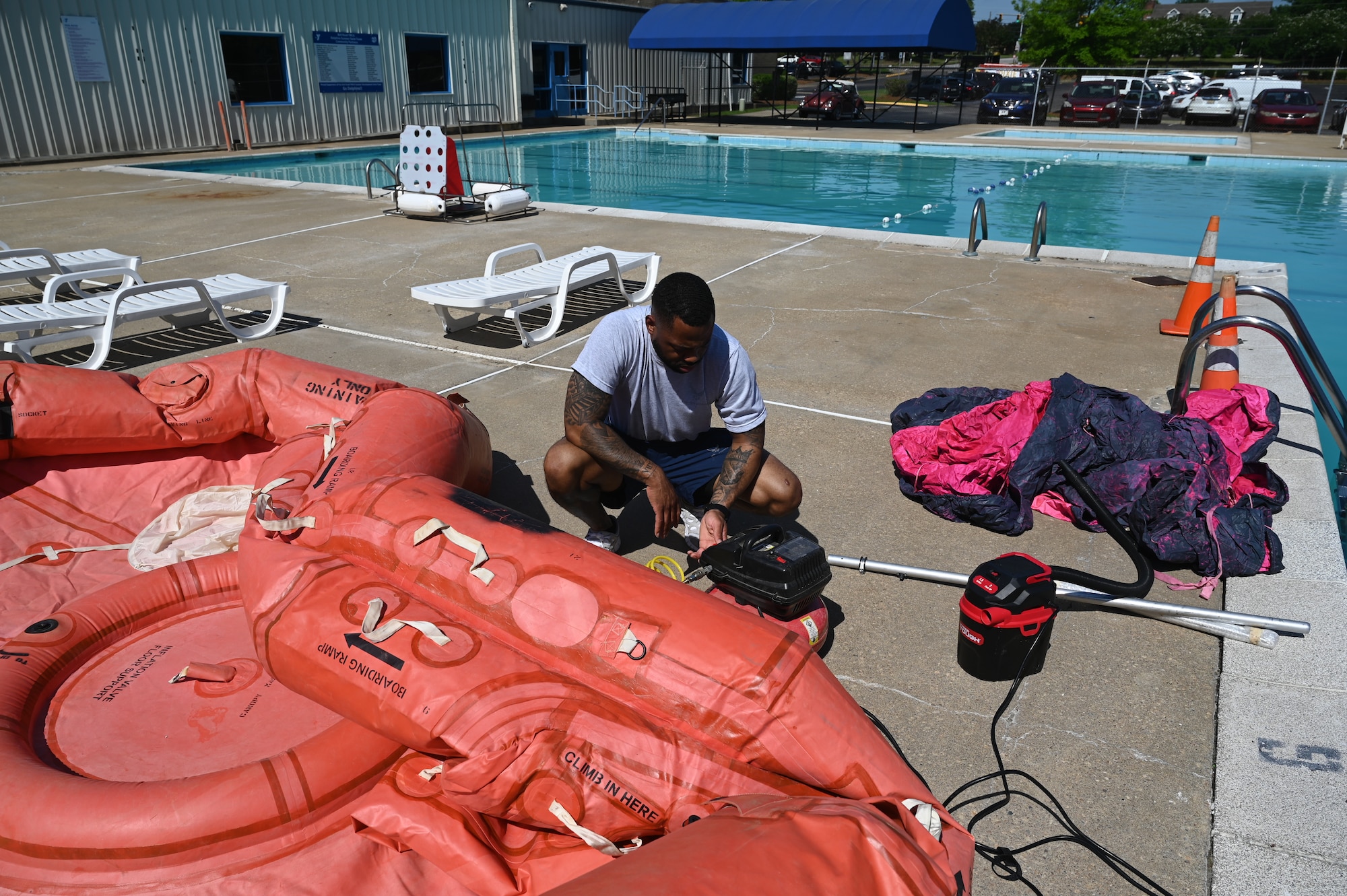 a person fills a raft with air.