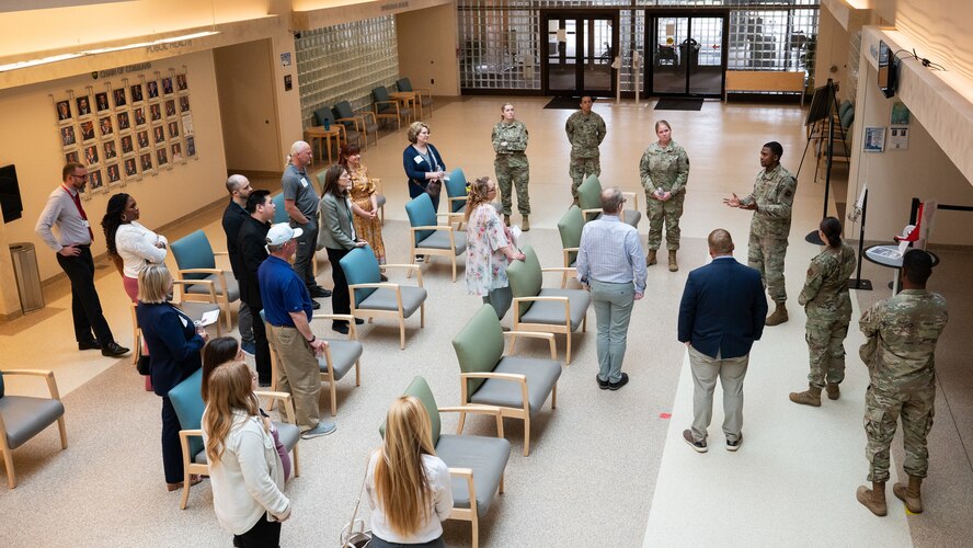 Airmen guide a tour of civilian medical providers inside Minot Air Force Base's hospital.