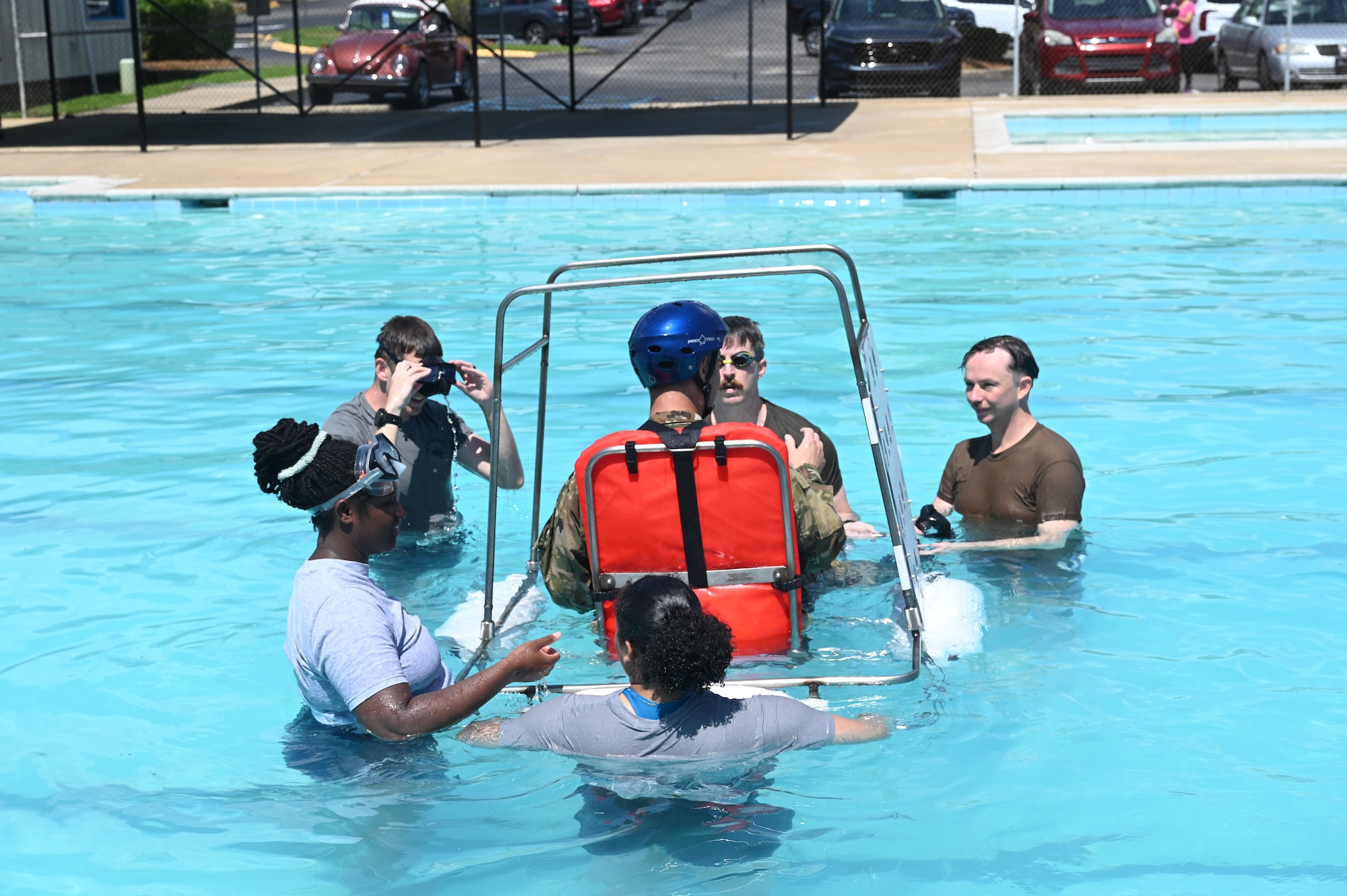 people prepare to flip someone under water