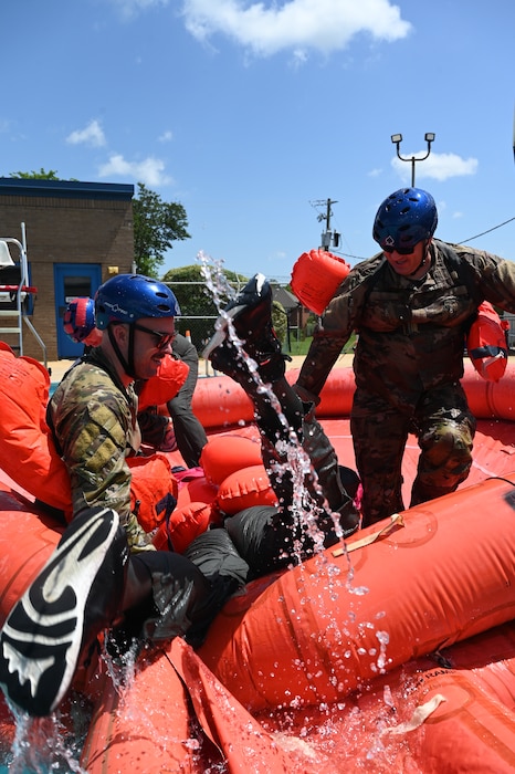 people help someone onto a life raft