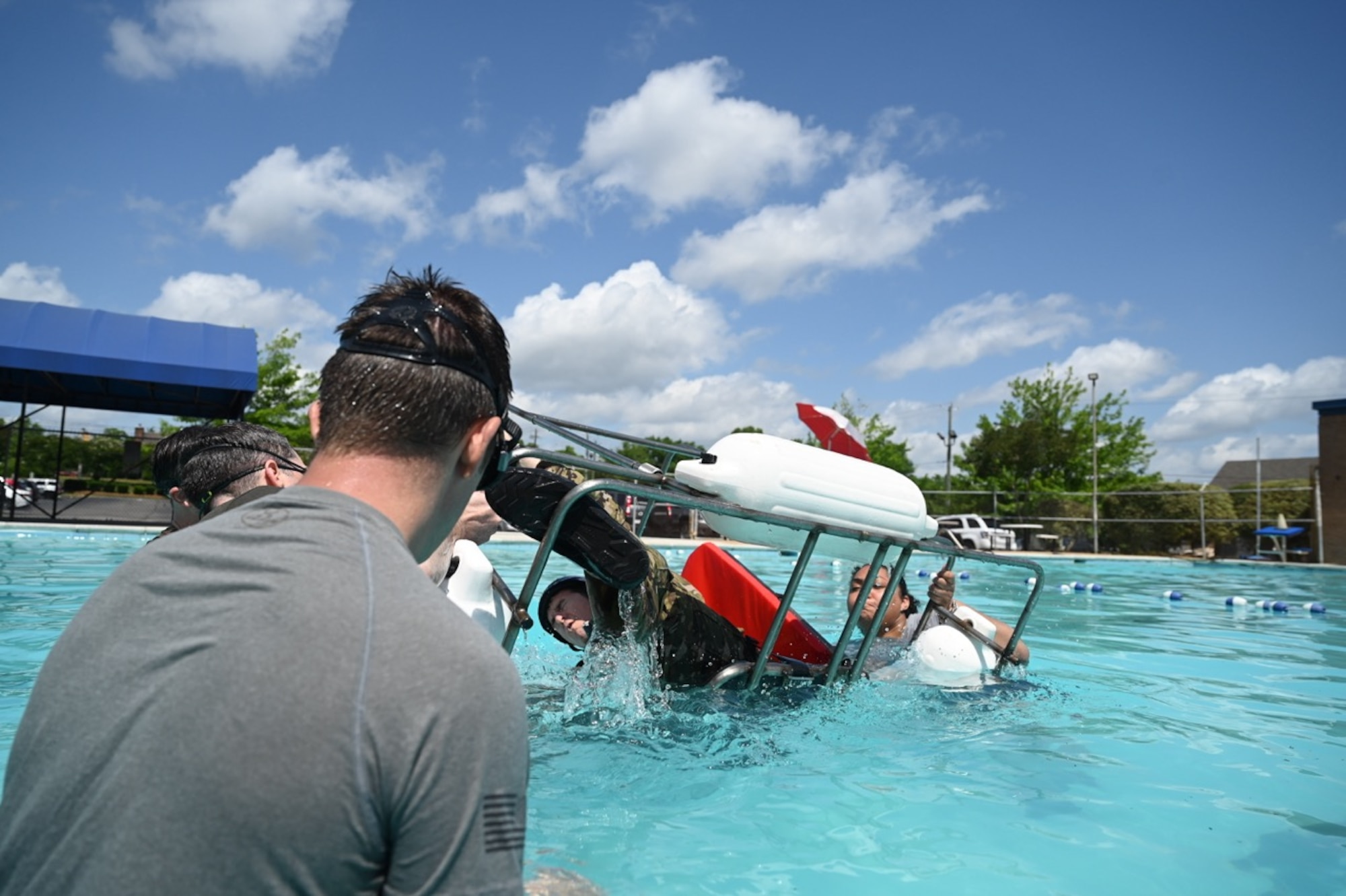 a person watches another flip under water