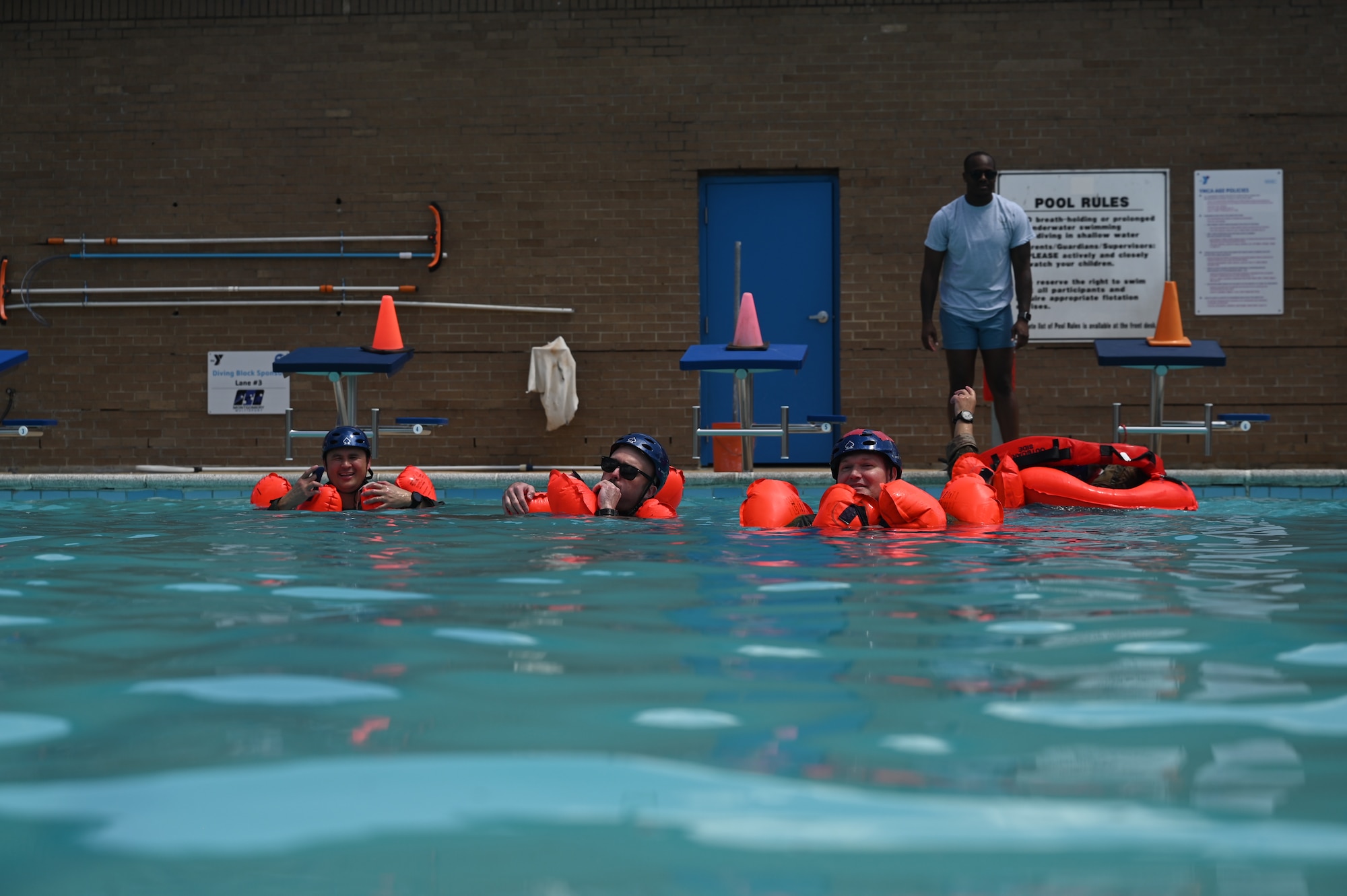 people float in a pool
