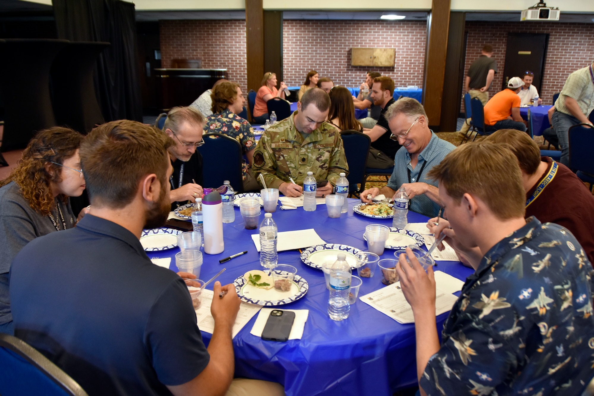 The judges get a taste for how some of the barbecue available during the 804th Test Group BBQ Cookoff stacks up against the competition, June 6, 2025, at the Arnold Lakeside Complex on Arnold Air Force Base, Tenn. During the annual event, several members of the 804th Test Group team vie for the coveted large wooden fork, the trophy given to the cookoff victor, by preparing barbecue which is not only shared with colleagues across the test group, but also judged by several others on the 804TG team. (U.S. Air Force photo by Bradley Hicks)