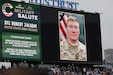 Sgt. 1st Class Robert Zalabak's photo appears on the Wrigley Field jumbotron during a Chicago Cubs Military Salute recognition, June 12, 2025.