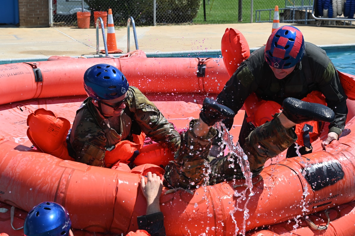 people help someone onto a life raft