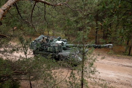A U.S. Army M109A7 Paladin self-propelled howitzer with Alpha Battery, 1st Battalion, 41st Field Artillery Regiment, 1st Armored Brigade Combat Team, 3rd Infantry Division, supporting Task Force Iron, moves to the live-fire range during exercise Crystal Arrow at Camp Adazi, Latvia, May 19, 2025. Exercise Crystal Arrow 2025 focuses on brigade-level operations, training full-scale defense operations in conventional urban warfare, aiming to replicate real-life scenarios as closely as possible. Task Force Iron's mission is to engage in multinational training and exercises across the continent to increase lethality, while strengthening partnerships with our NATO allies and regional security partners. The task force provides combat-credible forces to V Corps, America’s only forward-deployed corps in Europe. (U.S. Army photo by Sgt. Rachel Hall)