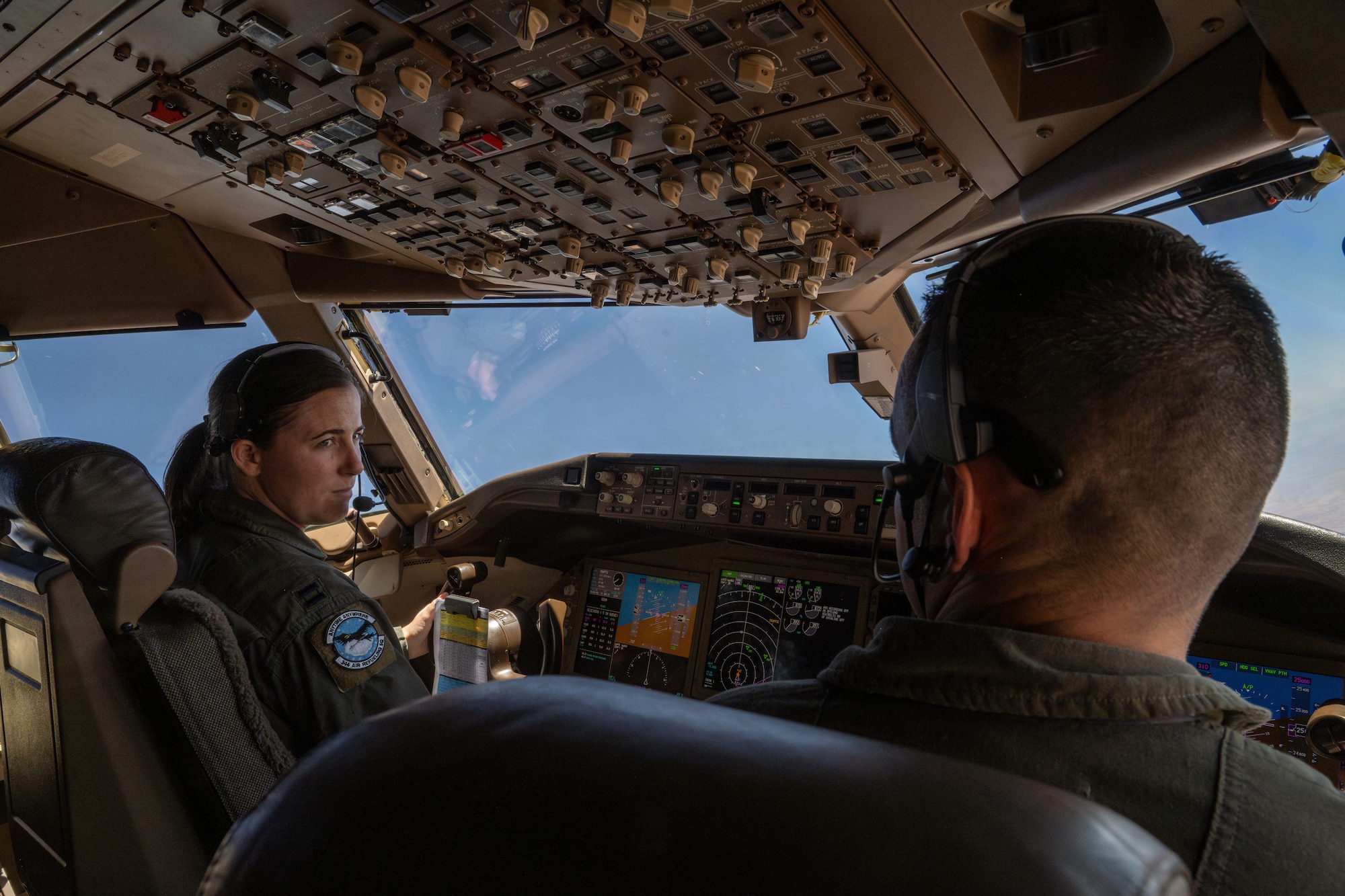 Capt. Elizabeth "Sully" Brakefield, 344th Air Refueling Squadron KC-46A Pegasus pilot, and Capt. Cody Nelson, 22nd Operations Support Squadron KC-46 pilot, fly a KC-46 over the U.S., June 13, 2025. During this flight, the aircrew conducted a pilot checkride, over 20 training requirements, and offloaded 75,000 pounds of fuel. (U.S. Air Force photo by Airman 1st Class Paula Arce)