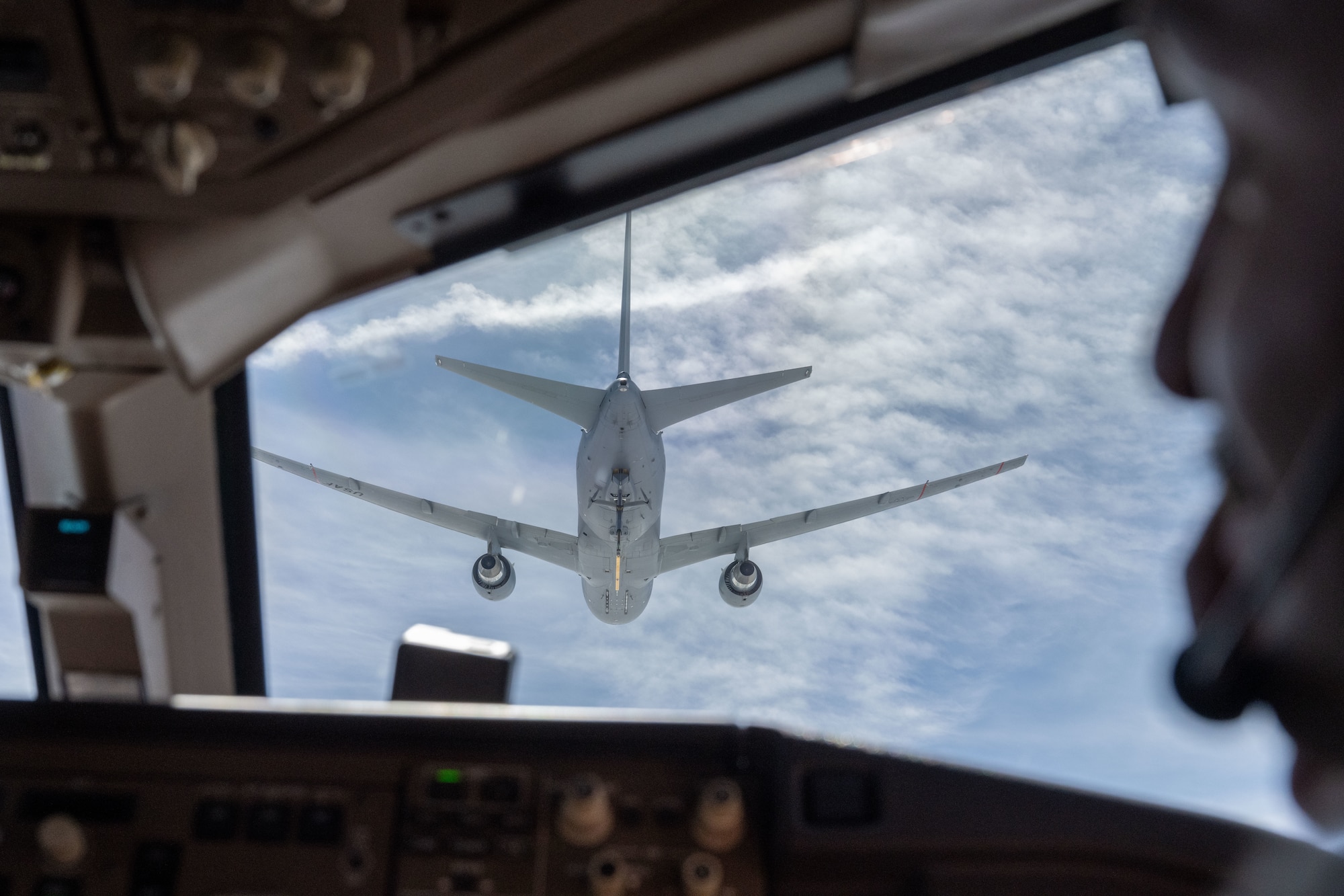 A KC-46A Pegasus assigned to McConnell Air Force Base prepares to refuel a KC-46 over the U.S., June 13, 2025. The KC-46’s refueling boom can refuel most fixed-wing, receiver-capable aircraft. (U.S. Air Force photo by Airman 1st Class Paula Arce)