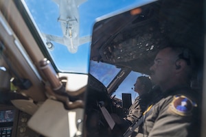 Capt. Elizabeth "Sully" Brakefield, 344th Air Refueling Squadron KC-46A Pegasus pilot, and Capt. Cody Nelson, 22nd Operations Support Squadron KC-46 pilot, fly a KC-46 over the U.S., June 13, 2025. During this flight, the aircrew conducted a pilot checkride, over 20 training requirements, and offloaded 75,000 pounds of fuel. (U.S. Air Force photo by Airman 1st Class Paula Arce)