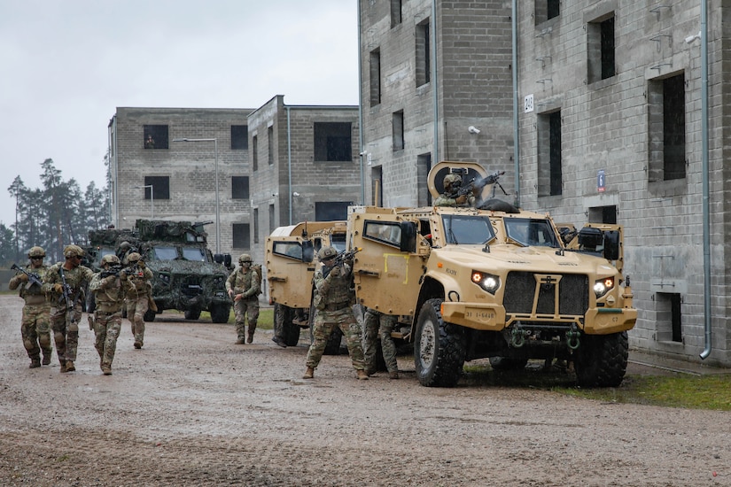 U.S. Army soldiers assigned to Charlie Company, 1st Battalion, 64th Armored Regiment, 1st Armored Brigade Combat Team, 3rd Infantry Division, supporting Task Force Iron, joined multinational soldiers from Poland, Lithuania, Romania, and Czechia for Exercise Brave Boar in Bemowo Piskie Training Area, Poland, May 17, 2025. During the exercise, U.S. soldiers conducted joint training with NATO multinational partners in a simulated urban environment. Task Force Iron's mission is to engage in multinational training and exercises across the continent to increase lethality, while strengthening partnerships with NATO allies and regional security partners. The task force provides combat-credible forces to V Corps, America’s only forward-deployed corps in Europe. (U.S. Army photo by Sgt. Trevor Wilson)