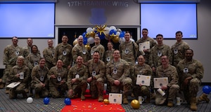 U.S. Air Force Master Sgt. selects assigned to the 17th Training Wing pose for a group photo during the Master Sergeant Release Party at the Powell Event Center, Goodfellow Air Force Base, Texas, June 16, 2025. The ceremony allowed wing leadership, family and friends to recognize the base’s newest master sergeant selects as they transition from technical sergeants to senior non-commissioned officers. (U.S. Air Force photo by Airman 1st Class Brian Lummus)