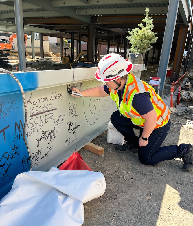 Signing structural beam for building.